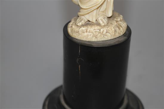 A 19th century Dieppe carved ivory figure of St Joseph holding the Christ child, 16cm, on ebony socle, overall height 26.5cm